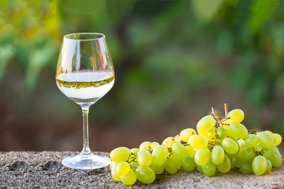 Glass of White Wine and Green Grapes